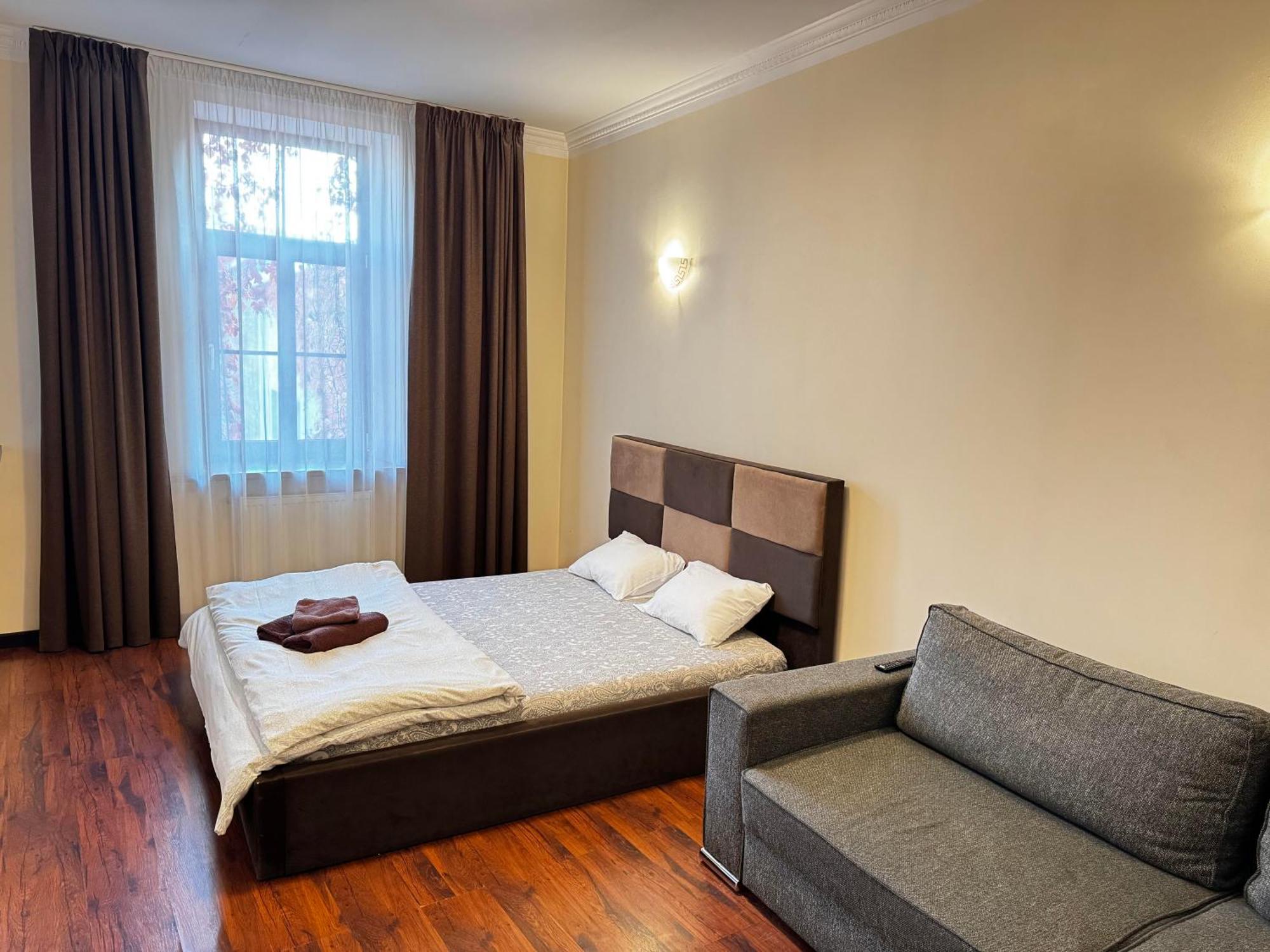 Aparthotel Riga Exteriör bild A bedroom in a hotel