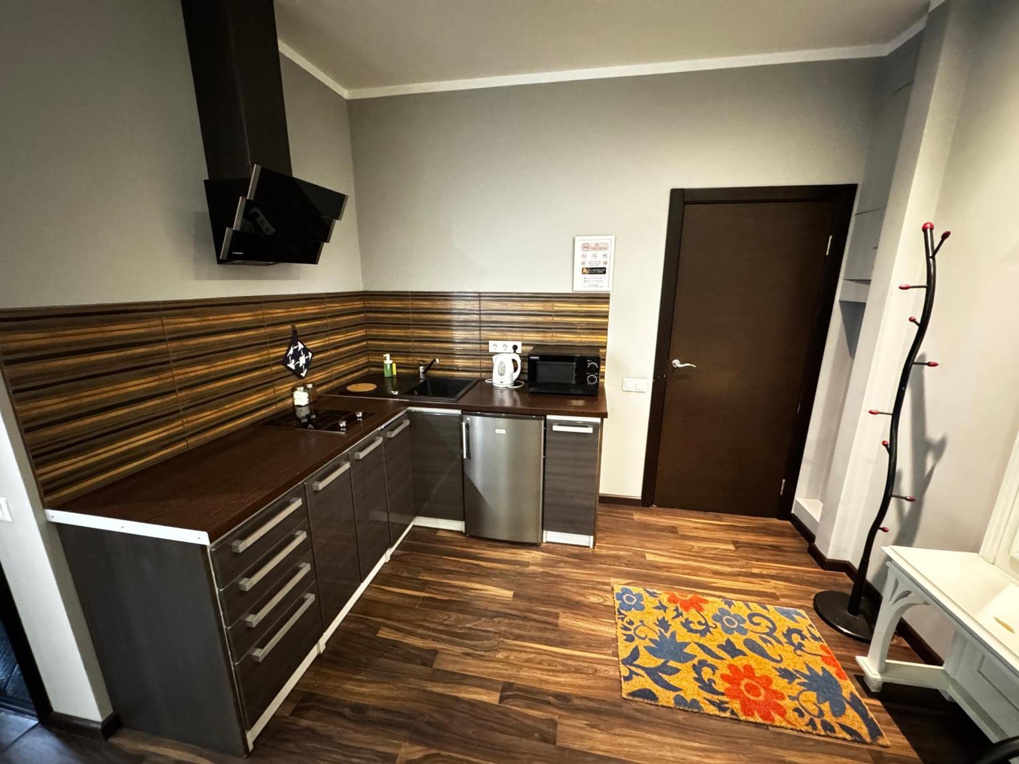 Aparthotel Riga Exteriör bild A typical kitchen in a typical apartment